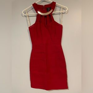 Red high neck, bodycon mini dress with gold piece accent and cutouts